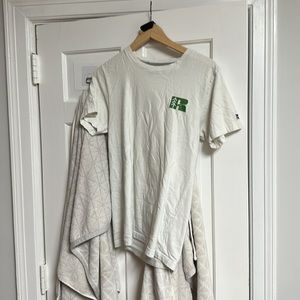 The brand is Russell and the size is small and is white with green and blue.